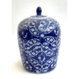 A Chinese blue and white lidded jar with prunus design, 30cmH