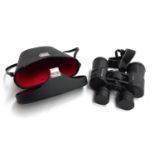 A pair of Meade 10x50 long eyerelief binoculars in carry case