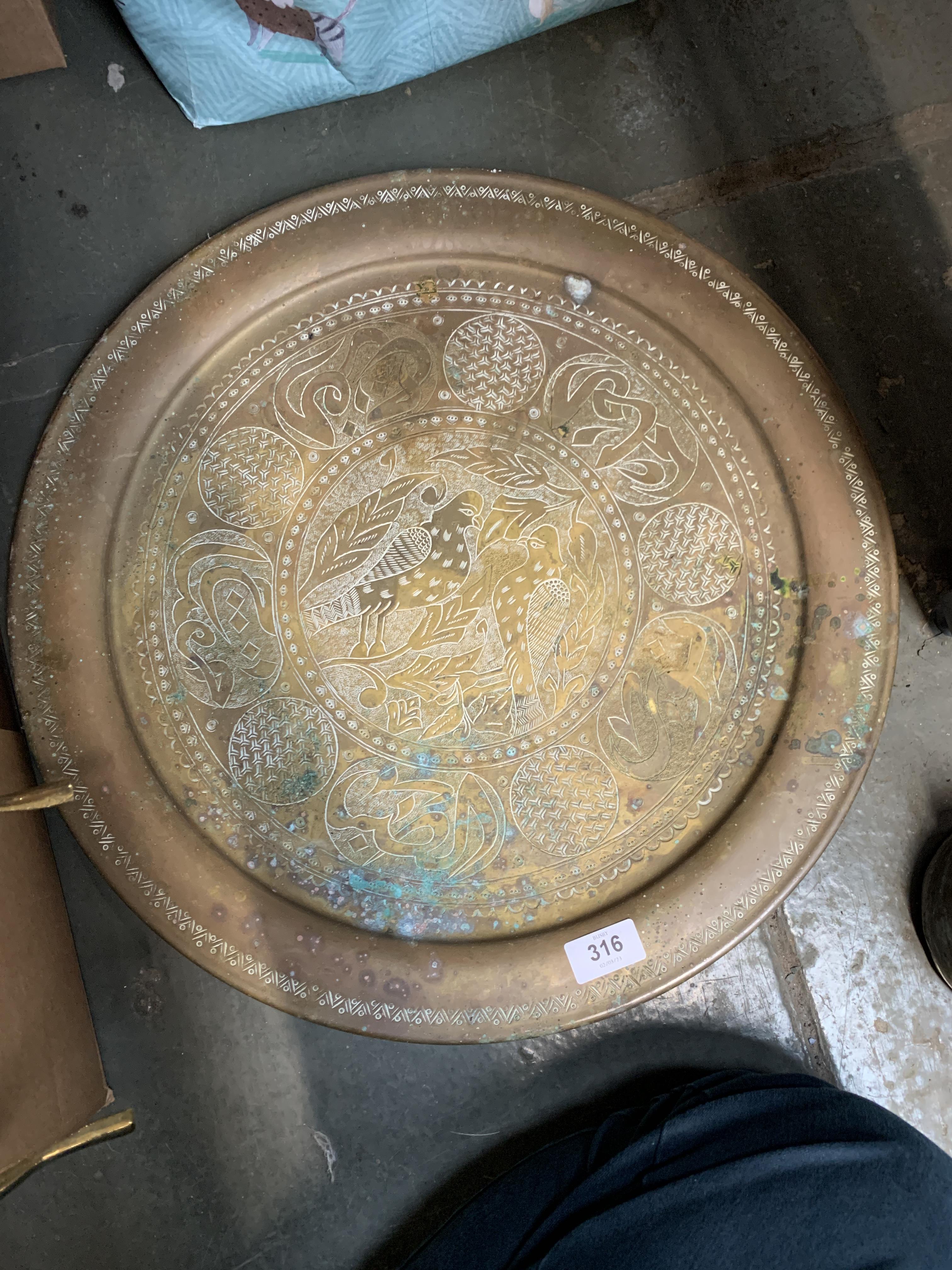 Two worked Islamic metal trays, 49cmW and 36cmW; together with a similar plaque and two flasks - Image 9 of 11