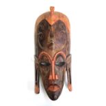 A modern Kenyan wooden mask, marked Jambo Kenya 2006 inside, 53cmL