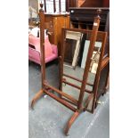 An Edwardian cheval mirror, the square section supports with urn finials, approx 81cmW