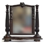A Victorian adjustable dressing mirror, carved in Jacobethan taste, approx. 91cm wide