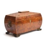 A Regency burr yew and line inlaid bombe form sarcophagus tea caddy, the interior with two lidded