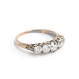 A late Victorian diamond five stone ring, unhallmarked but test as 18ct or higher, size O 1/2