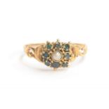 A Victorian gold, pearl and tourmaline floral cluster ring, the shank with scrolling shoulders,