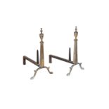 A pair of pressed andirons in George III style, with urn finials above the tapering stems and