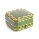 An early 20th century Cartier presentation box, green morocco leather with gilt embossed design, the