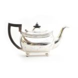 A silver teapot by Barker Brothers Ltd, Chester, of rectangular form with blackwood harp handle,