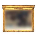 A Regency giltwood overmantel mirror, the plate flanked by reeded Corinthian pilasters, 71cm wide,