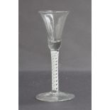 A mid 18th century cordial glass, opaque twist stem on folded foot, 16cm high