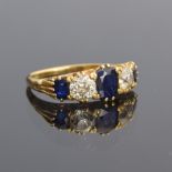 An 18ct gold sapphire and diamond five stone ring, the diamonds each approx. 0.5ct, size P,
