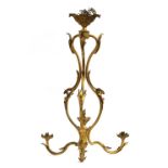 A French gilt brass three arm ceiling light of scrolling foliate form, 74cm high
