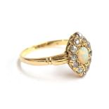 An 18ct gold diamond and opal marquise ring, size Q 1/2, approx. 3.1g