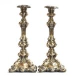 A pair of probably Italian rococo silver candlesticks, with removable nozzles, each 33cm high, 24.