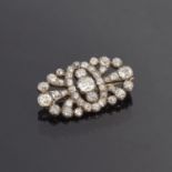 A Victorian diamond brooch of openwork form, set with 41 old cut diamonds in pinched collet