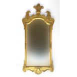 A George II style giltwood wall mirror, 20th century, the cresting centred by three feathers and