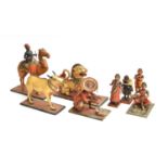 A collection of eight late 19th/early 20th century Indian painted papier mache folk art toys in