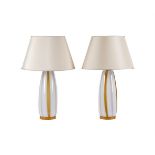 A pair of opaque and amber glass table lamps, with paper 'Gingham' shades, 64cm high overall