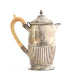 A Victorian silver coffee pot, London 1875, with bright cut vine leaf border, over an armorial