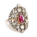 A Victorian 18ct gold and silver openwork ring, 38 old cut diamonds surrounding a central ruby, appr