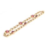 A Cassandra Goad 9ct gold necklace, the chain interspersed with six gold mounted pink tourmaline