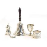 A small lot of silver to include a silver jubilee bell, London 1977; an eggcup; pepper; silver