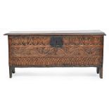 A 17th century and later six plank coffer, carved with various motifs, 113cm wide, 38cm deep, 51cm