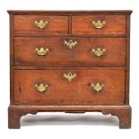 A small George III and later oak chest of two short over two long drawers, on bracket feet, 80cm
