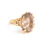 An 18ct gold dress ring set with a large smoky quartz, size S 1/2, 6.7g