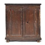 A Tuscan cabinet, 83cm wide, 35cm deep, 88cm high, the doors opening to two internal shelves