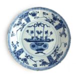 A 19th century Chinese export blue and white plate decorated with precious objects, 25cm diameter