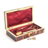 A 19th century French tortoiseshell cased gold etui, the hinged lid af, with fitted red velvet