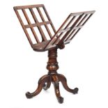 A Victorian walnut portfolio stand, the two slatted hinged leaves on a brass ratchet mechanism (