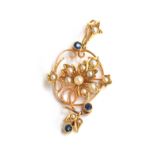 An Edwardian 15ct gold pendant of foliate form, set with seed pearls and sapphires, 4cm long,