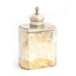 A white metal tea canister, domed cover with finial, the canister of canted oblong form, 13cm