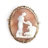 A 19th century gold mounted shell cameo depicting a classical scene of a Grecian woman holding a