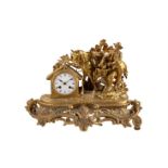 A late 19th century French gilt metal mantel clock, case with figural decoration of boy with