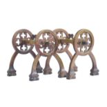 A pair of Victorian Gothic Revival fire dogs with quatrefoil cutout design, bearing rd number, 18.