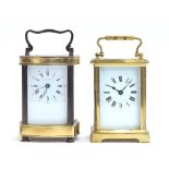 Two French brass carriage clocks, one with dial signed 'Jean Renet', each approx. 11.5cm high