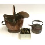 A copper helmet coal scuttle, 43cmH to top of handle, together with a copper kettle and various