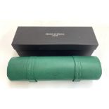 A boxed Heisse & Sohne green imitation leather watch roll