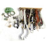 A mixed lot of costume jewellery to include 835 silver pendant, shell necklace, enamel pendant, faux