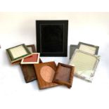 A quantity of photo frames to include an Elite floral frame purchased from Harrods, burr wood etc (