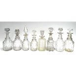A lot of eight various cut glass decanters, to include two pairs (stoppers mismatched)