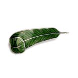 A silver and enamel Holland & Holland brooch in the form of a green feather, 4.5cm long, 7.2g