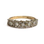 A 9ct gold ring set with white stones, one missing, 2.5g. size Q
