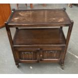 An oak hostess trolley with linenfold doors, 62cmW