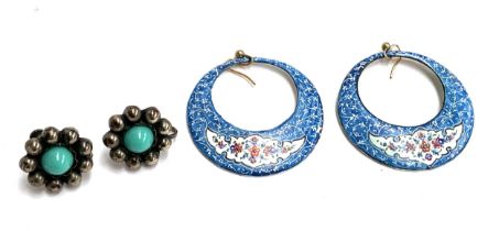 A pair of Persian minakari enamel hoop earrings with yellow metal hooks; together with silver floral