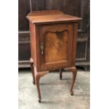 A mahogany and walnut bedside pot cupboard, on cabriole legs, 41x38x79cm