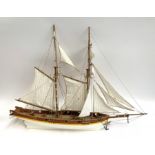 A scratch built model of a sailing ship, with anchor and life boat, approx. 68cmL